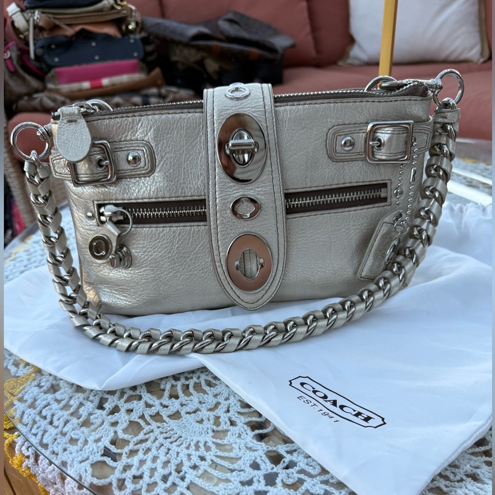 Coach
This vintage and limited-edition Coach Bridget legacy metallic bag